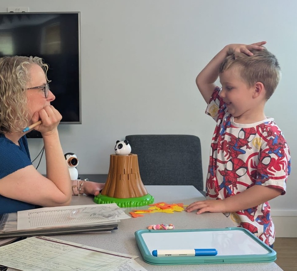 Kate with child during speech sound therapy